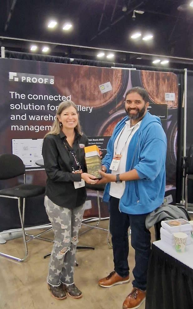 Proof 8 team celebrating at a trade show